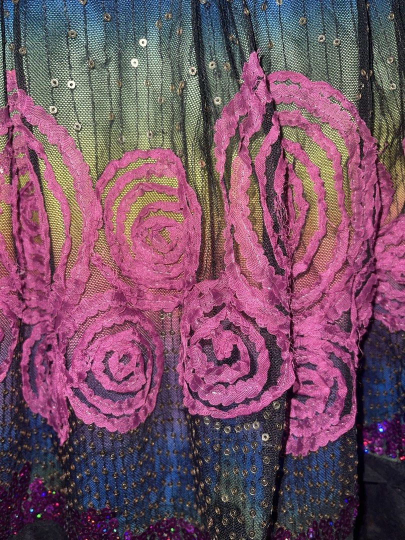 Whimsy Rainbow Mesh Sequin Dress with Rose Applique (Category: Dresses) located in La Trinidad. Submitted by potatothriftlip (Listing ID 1468828031, Image 3). Description: - Vibrant multi-color rainbow gradient mesh dress - Elegant black lace cap sleeves and pleated flared skirt - Lower skirt features striking pink rose appliques and scattered gold sequins - Detailed patterned waistband with a ruffled button placket down the front - Convenient si