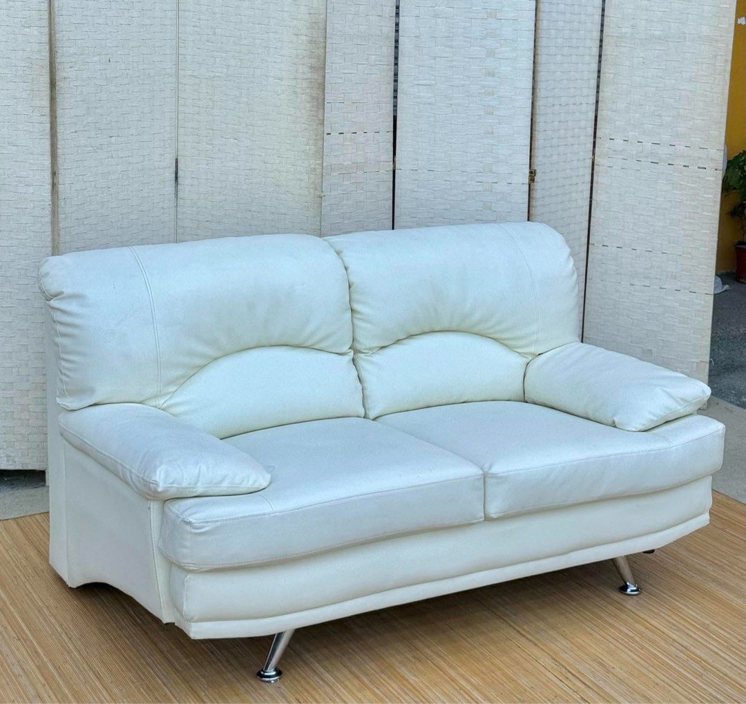 White 2-Seater Leather Sofa with Chrome Legs (Category: Sofas) located in Manila. Submitted by justinlei.103 (Listing ID 1468849675, Image 1). Description: JAPAN SURPLUS 2 SEATER WHITE LEATHER SOFA IN GOOD CONDITION SIZE: 16H x 59L x 33.5W inches.