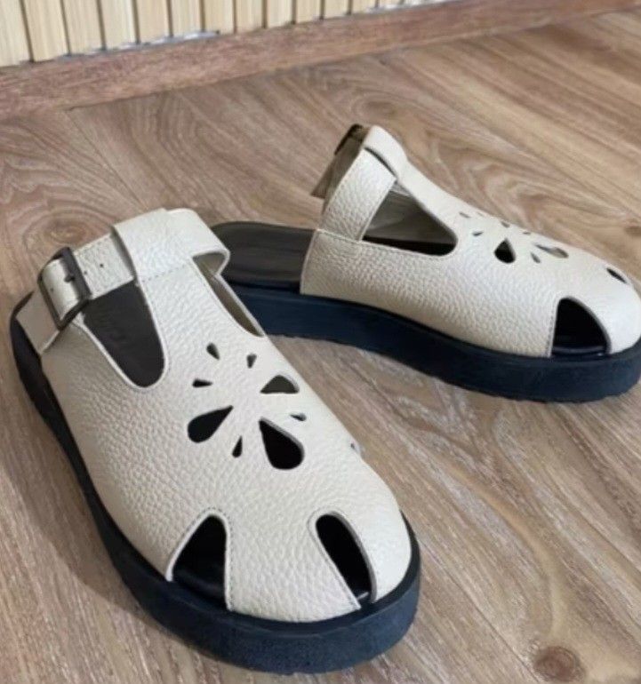 White / Beige Kendra Sandals (RF dupe) (Category: Flats & Sandals) located in Cavite. Submitted by chbii03 (Listing ID 1468789820, Image 1). Description: - Color: White upper with contrast thick black platform soles - Design: Cute cutout flower details on top with a slip-on mule style - Fit: Adjustable side buckle straps for a secure fit - Comfort: Very comfortable for all-day wear - Styling: Easy to style with or without socks RFS: Too big. My f
