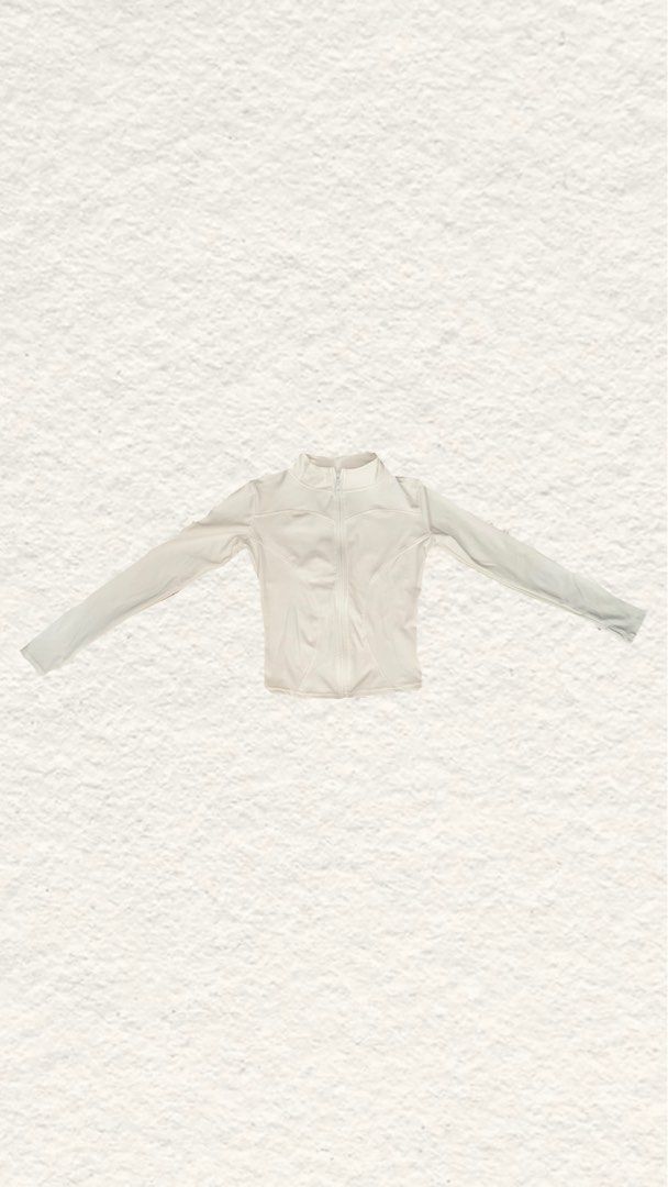White athletic zip-up jacket activewear (Category: Coats, Jackets and Outerwear) located in Quezon City. Submitted by zealhorse_a9f3c3 (Listing ID 1468797626, Image 1). Description: - Color: Clean White - Style: Athletic zip-up jacket with a modern high collar - Fit: Form-fitting cut with curved panel seams for a flattering silhouette - Material: Smooth, stretchable fabric for maximum comfort - Versatility: Ideal for workouts, runs, or casual dai