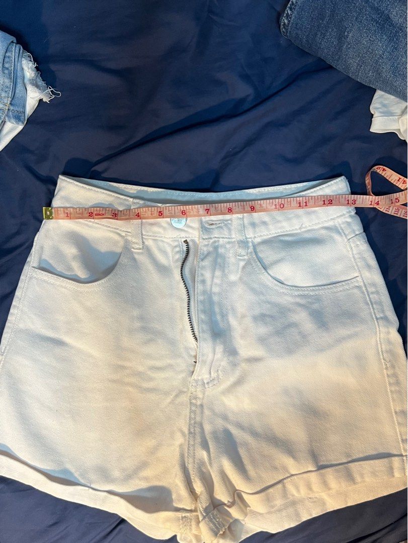 White denim rolled cuff shorts (Category: Shorts) located in Marikina City. Submitted by yssacee (Listing ID 1468921396, Image 1). Description: - Color: White - Style: Denim shorts with cuffed hems and front zipper closure - Pockets: Two front pockets, two back patch pockets - shipping from lower antipolo rizal - rfs does not fit me anymkre .