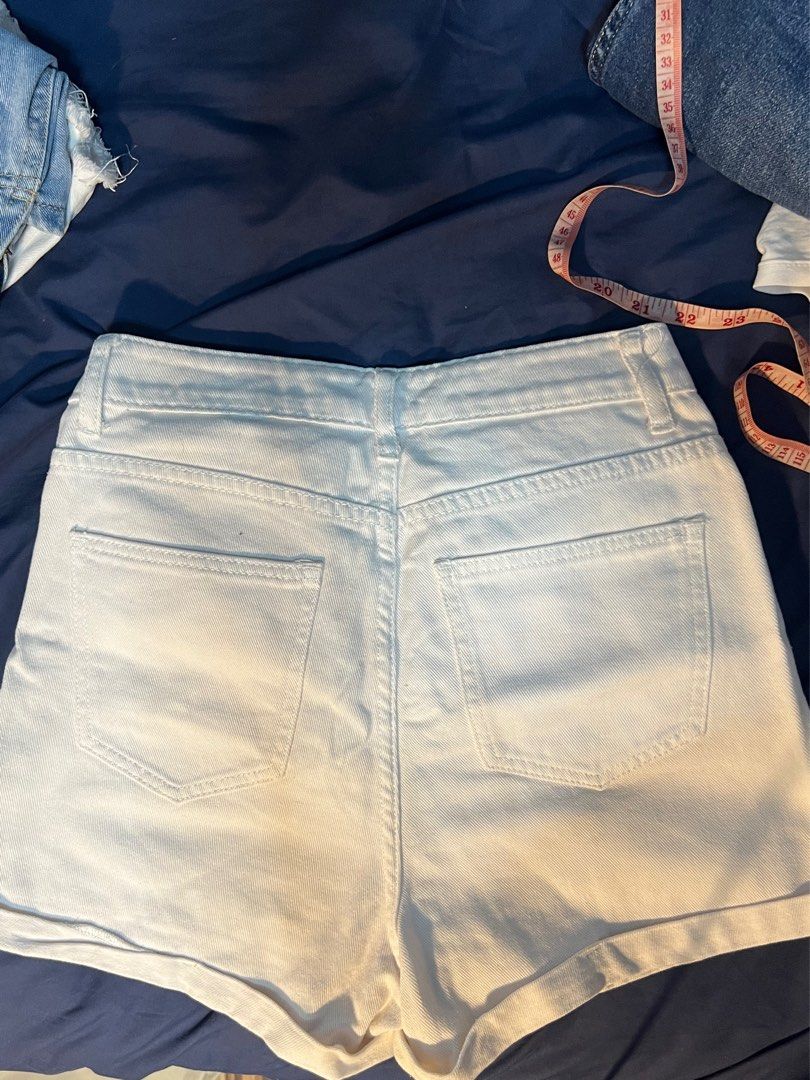 White denim rolled cuff shorts (Category: Shorts) located in Marikina City. Submitted by yssacee (Listing ID 1468921396, Image 3). Description: - Color: White - Style: Denim shorts with cuffed hems and front zipper closure - Pockets: Two front pockets, two back patch pockets - shipping from lower antipolo rizal - rfs does not fit me anymkre .