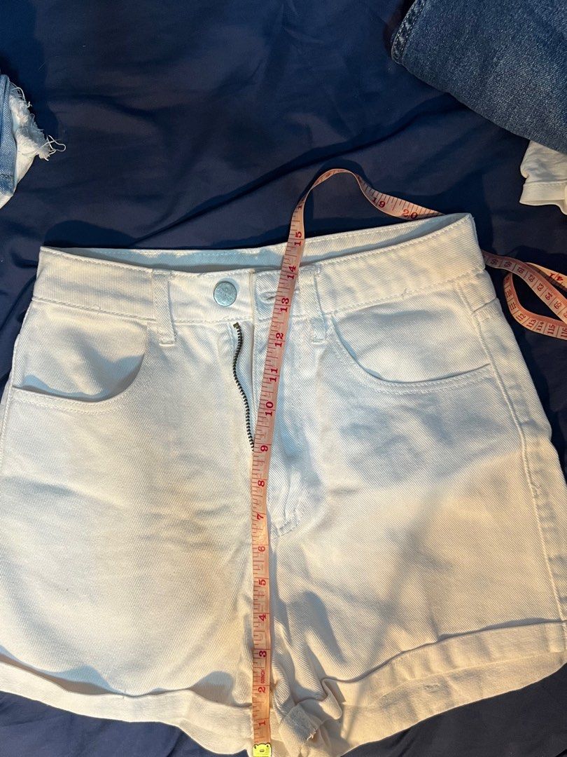 White denim rolled cuff shorts (Category: Shorts) located in Marikina City. Submitted by yssacee (Listing ID 1468921396, Image 2). Description: - Color: White - Style: Denim shorts with cuffed hems and front zipper closure - Pockets: Two front pockets, two back patch pockets - shipping from lower antipolo rizal - rfs does not fit me anymkre .
