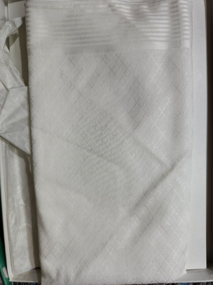 White Japanese Patterned Fabric with Gift Box (Category: Dresses) located in San Leonardo. Submitted by burgossanleonardo.12345 (Listing ID 1468766940, Image 3). Description: - Authentic traditional Japanese craft fabric in white - Features a subtle diamond grid pattern and stylish banded top border - Neatly folded and ready for sewing, crafting, or gifting - Comes in a beautiful presentation box with a lavender lid and green floral side panel.