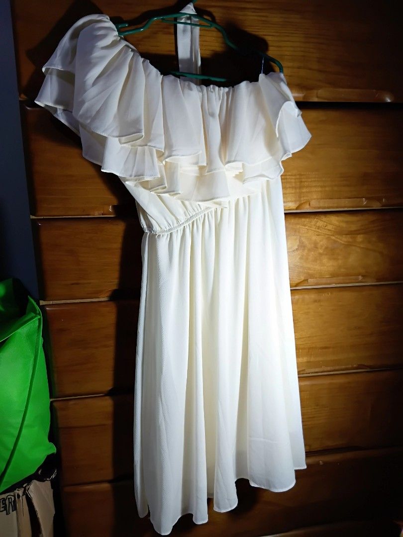 White one-shoulder ruffle midi dress (Category: Dresses) located in Angeles City. Submitted by kmangalindan_ (Listing ID 1468766483, Image 2). Description: - Style: White one-shoulder dress with layered ruffles on the chest and an asymmetrical hem - Fabric: Lightweight and breezy material, perfect for events or casual days - Condition: Worn only once, freshly washed, and properly stored - Size: Fits a medium frame - Reason for selling: Declutteri