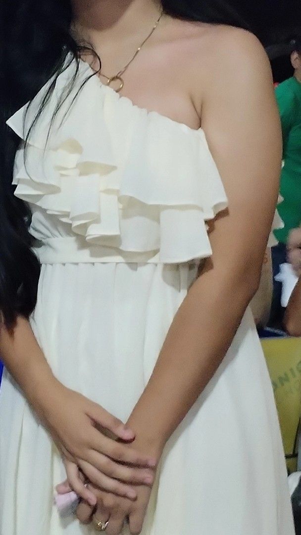 White one-shoulder ruffle midi dress (Category: Dresses) located in Angeles City. Submitted by kmangalindan_ (Listing ID 1468766483, Image 1). Description: - Style: White one-shoulder dress with layered ruffles on the chest and an asymmetrical hem - Fabric: Lightweight and breezy material, perfect for events or casual days - Condition: Worn only once, freshly washed, and properly stored - Size: Fits a medium frame - Reason for selling: Declutteri