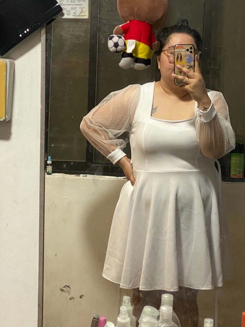 white plus size dress (Category: Longsleeves) located in Manila. Submitted by micadanillie (Listing ID 1468896309, Image 1). Description: - Brand: SHEIN Curve - Size: 2XL - Color: White - Style: Long sleeve blouse with square neckline - Features: Corset-style structured bodice, chest draping overlay, sheer sleeves, and satin-finish lower bodice with boning details - Condition: Worn a few times, still in great sha.
