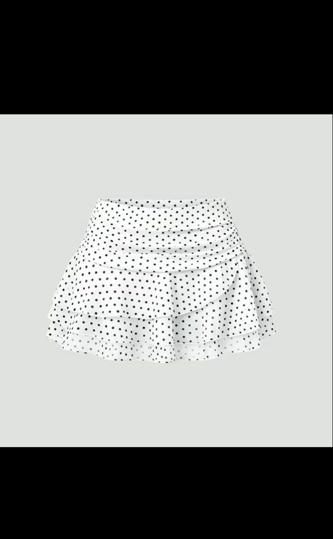 White Polka Dot Ruffle Mini Skirt (Category: Skirts) located in Quezon City. Submitted by taylorcutie (Listing ID 1468924940, Image 1). Description: - Style: White mini skirt with classic black polka dots - Fit: High-waisted with gathered ruching at the top - Details: Flowy layered ruffles toward the hemline - Fabric: Lightweight and comfortable for warm weather - Vibe: Playful, flirty, and easy to style with basic tops or tanks.
