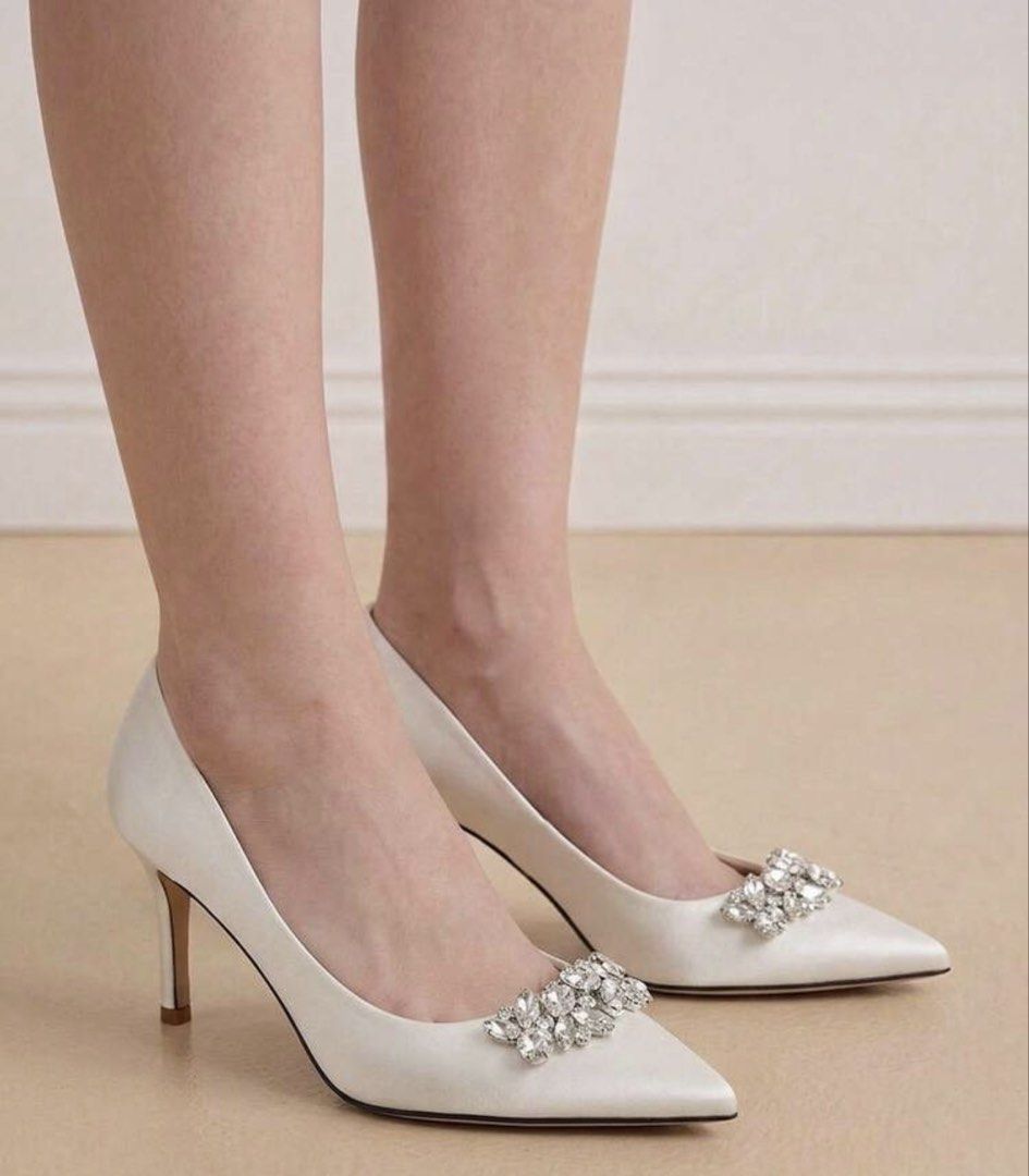 White Satin Pointed Toe Heels with Crystal Brooch (Category: Heels) located in Santo Tomas. Submitted by kylejao21 (Listing ID 1468877931, Image 1). Description: - Elegant white satin pumps with a smooth finish - Stylish pointed toe design with dazzling crystal embellishments - Classic stiletto heels for an elevated, sophisticated look - Clean interior lining featuring a chic gold stamped logo - Ideal for weddings, debuts, parties, and formal eve