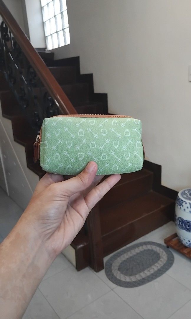 Why Coin Purse (Category: Wallets & Card holders) located in Naga. Submitted by camsss_f (Listing ID 1468747780, Image 2). Description: - Color & Design: Green with white key and lock pattern - Accents: Brown leather-look trim and gold zipper hardware - Interior: Dark brown fabric lining with a branded tag and small attached chain - Condition: Clean inside and out, smoke-free home - Use: Handy pouch for organizing small items in your everyday bag