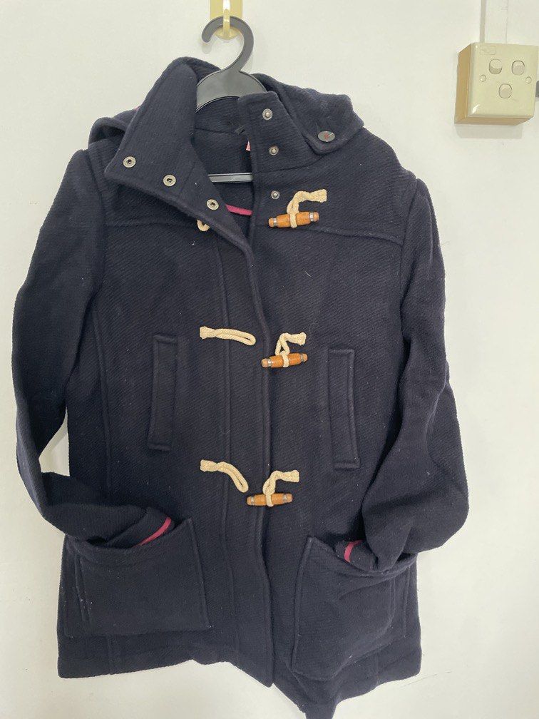 Winter outer jacket (Category: Coats, Jackets and Outerwear) located in Singapore. Submitted by ardent315 (Listing ID 1468734740, Image 1). Description: TOPSHOP Classic Navy Hooded Duffle Coat – UK 10 Timeless British-style duffle coat featuring: * Wooden toggle fastenings with cream rope loops * Cosy hood with red checked lining * Thick, warm textured fabric * High collar and practical front pockets * Stylish, flattering silhouette Size: UK 10 /