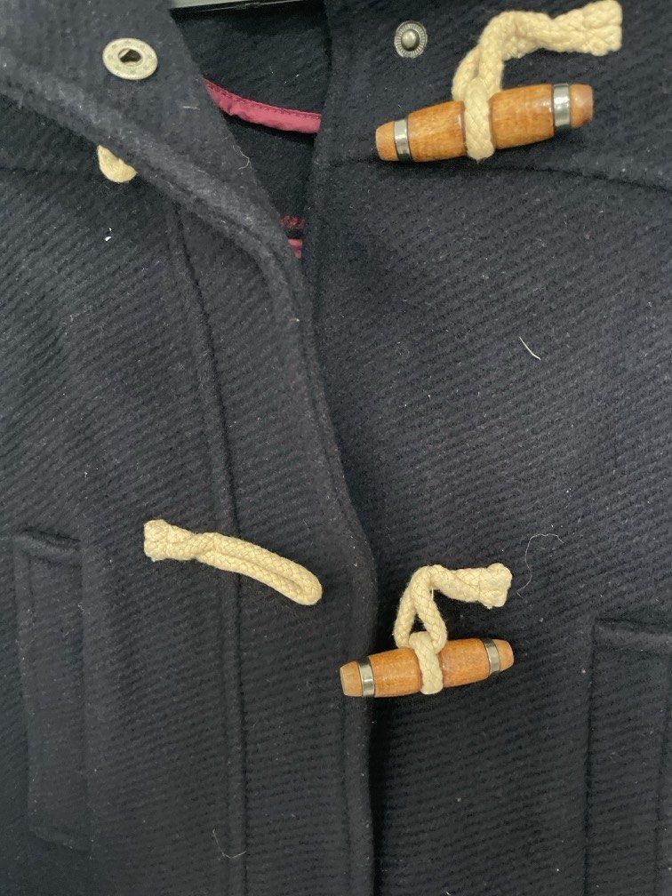 Winter outer jacket (Category: Coats, Jackets and Outerwear) located in Singapore. Submitted by ardent315 (Listing ID 1468734740, Image 2). Description: TOPSHOP Classic Navy Hooded Duffle Coat – UK 10 Timeless British-style duffle coat featuring: * Wooden toggle fastenings with cream rope loops * Cosy hood with red checked lining * Thick, warm textured fabric * High collar and practical front pockets * Stylish, flattering silhouette Size: UK 10 /