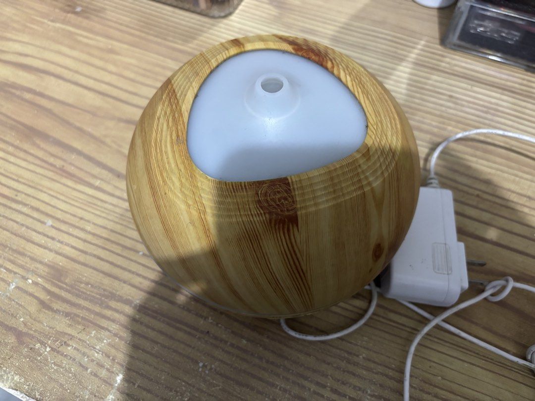 Wood grain essential oil diffuser humidifier with timer settings (Category: Home Fragrance) located in Manila. Submitted by shopmik4scloset (Listing ID 1468801865, Image 2). Description: Hi 👋🏽 Yes, it’s available :) Authentic & No issues 📍: Sampaloc Manila 🚚: Lalamove or J&T 💵: Gcash No meet ups, cod or free sf! .