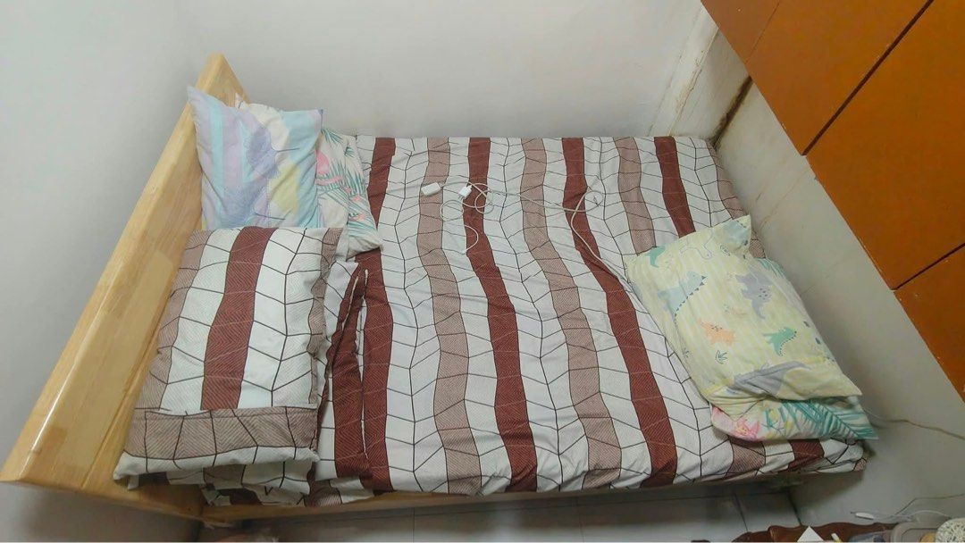 Wooden bed frame with headboard (Category: Bed Frames & Mattresses) located in Antipolo. Submitted by loveee0519 (Listing ID 1468788677, Image 3). Description: - Material: Solid wood with a light wood finish - Design: Clean natural wood grain pattern, minimalist style that matches any bedroom - Features: Sturdy headboard included, stable build with reliable support - Size: Fits standard mattress size nicely - Condition/Logistics: Ready for quick 