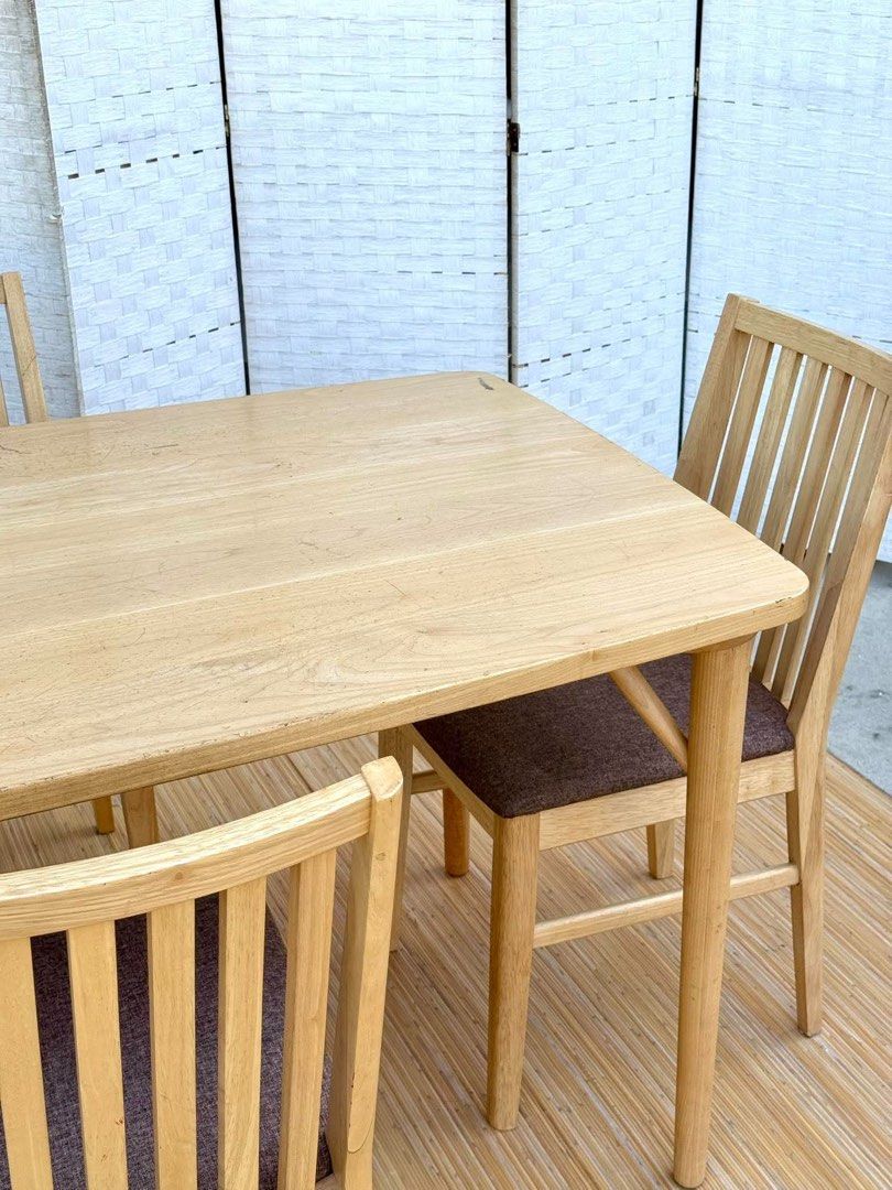 Wooden dining table with four cushioned chairs (Category: Tables & Sets) located in Manila. Submitted by justinlei.103 (Listing ID 1468808234, Image 3). Description: JAPAN SURPLUS NITORI 4 SEATER DINING SET IN GOOD CONDITION SIZE: 27.5H x 55L x 31.5W inches 17H x 16L x 16W inches.