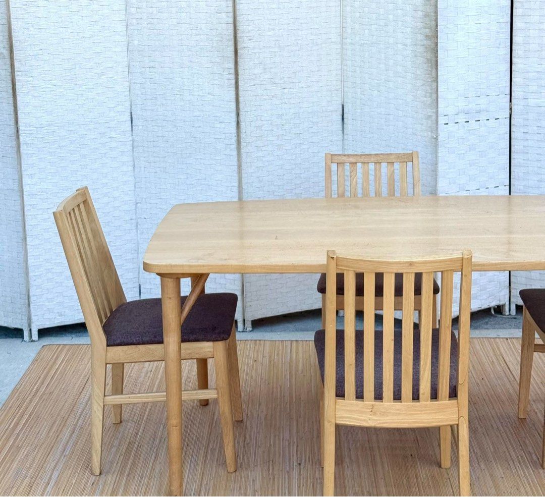 Wooden dining table with four cushioned chairs (Category: Tables & Sets) located in Manila. Submitted by justinlei.103 (Listing ID 1468808234, Image 1). Description: JAPAN SURPLUS NITORI 4 SEATER DINING SET IN GOOD CONDITION SIZE: 27.5H x 55L x 31.5W inches 17H x 16L x 16W inches.