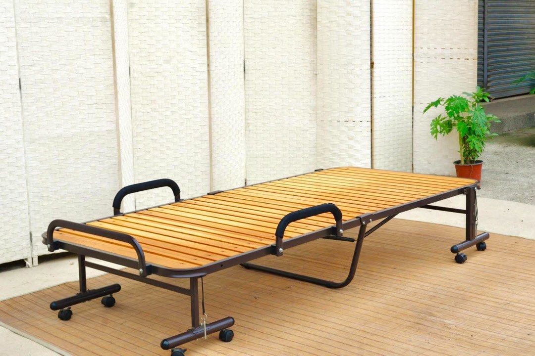 Wooden Foldable Single Bed with Wheels (Category: Bed Frames & Mattresses) located in Manila. Submitted by justinlei.103 (Listing ID 1468843258, Image 1). Description: JAPAN SURPLUS FURNITURE FOLDING BED (LIKE NEW CONDITION) Size 80L x 36W x 13.5H in inches (AS-IS ITEM) *Minimal Scratch Only IN GOOD CONDITION.