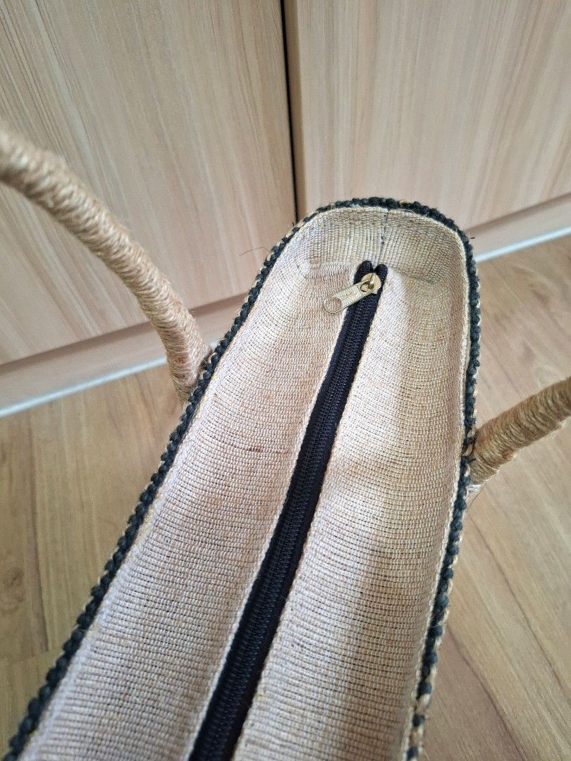 Woven Straw Tote Bag with Striped Pattern and Handles (Category: Tote Bags) located in Taguig. Submitted by mary_jeha (Listing ID 1468787863, Image 3). Description: Woven Tote Bag with Zipper Material: Woven straw with stylish black, brown, and beige stripes in a geometric diamond pattern. Has fabric inner lining. Handles: Dual twisted rope handles for a comfortable and secure grip - spacious interior - ideal for everyday use, shopping, or beach 