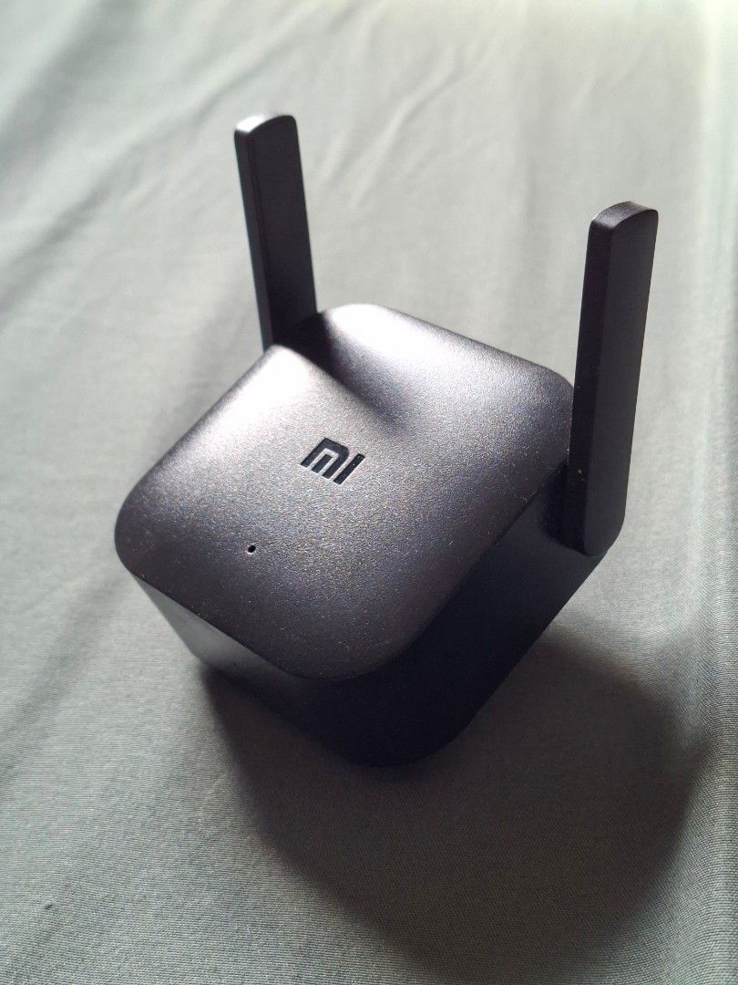 Xiaomi WiFi Repeater Pro (Category: Networking) located in San Pedro. Submitted by epic.ryan_01 (Listing ID 1468715304, Image 1). Description: - Model: Xiaomi WiFi Repeater Pro (R03) - Color: Sleek black finish - Coverage: Dual external antennas for extended home network coverage - Setup: Quick and easy setup via the Mi Home app - Convenience: Direct wall plug-and-play design ₱450 negotiable..