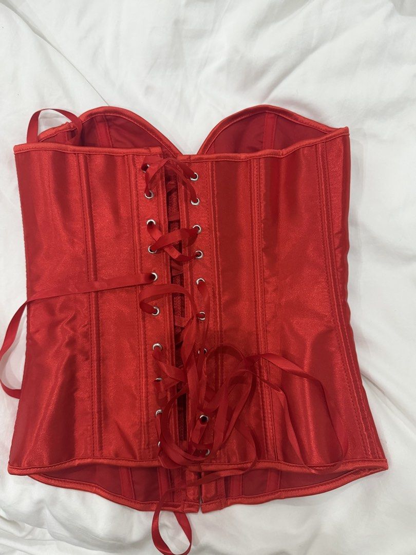 XS - Red Satin Corset Top (Category: Sleeveless) located in Manila. Submitted by calmcloud-ff9802 (Listing ID 1468876578, Image 2). Description: - Condition: Brand new, still sealed in original packaging with barcode label - Size: XS - Material: Vibrant red satin with structured boning throughout - Closure: Front metal hook busk closure - Fit: Adjustable back lace-up ribbon system - RFS: I liked my backup customer better for halloween .
