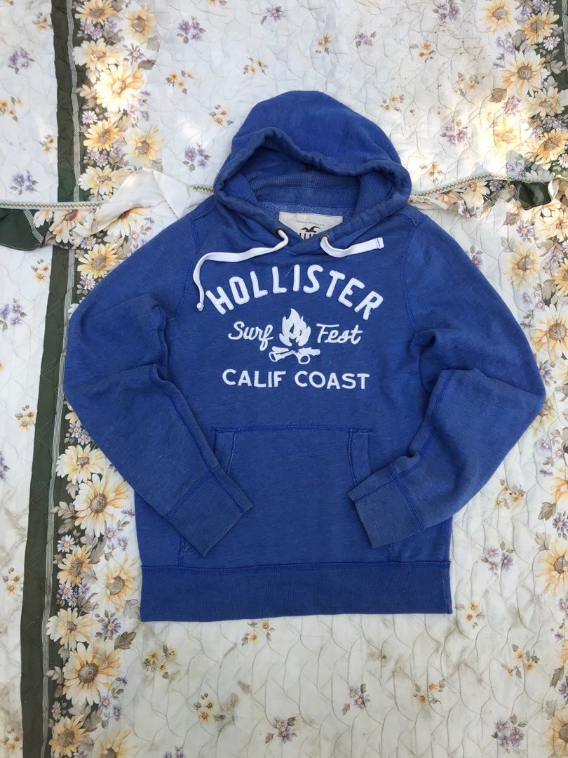 Y2K HOLLISTER PULL OVER HOODIE (Category: Coats, Jackets and Outerwear) located in Salug. Submitted by bagdoi_finds (Listing ID 1468867024, Image 1). Description: blue Hollister Co.’ “Surf Fest Calif Coast” pullover fleece hoodie from the 2000s Y2K.