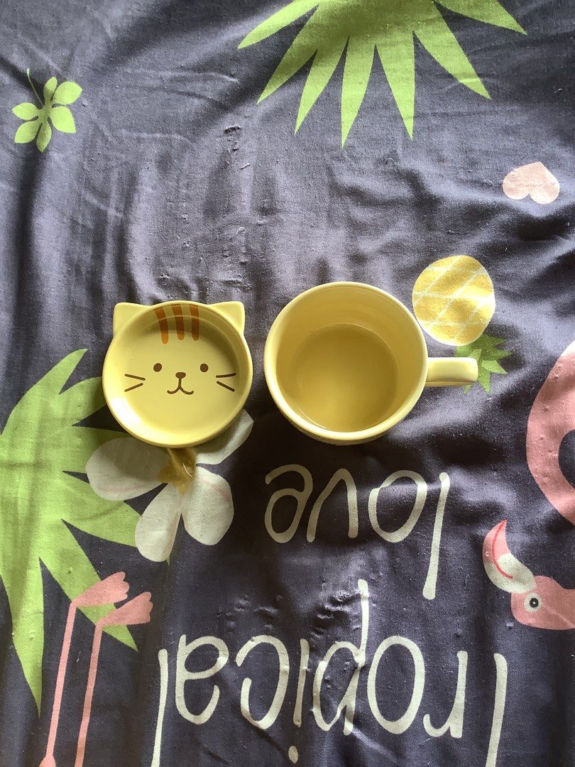 Yellow Cat Mug and Matching Cat Face Dish Set (Category: Coffee & Tea Tableware) located in Manila. Submitted by yugixoama95259 (Listing ID 1468742015, Image 1). Description: - Matching yellow ceramic mug and small dish set - Adorable cat-face dish complete with cute ears and whiskers - Simple, comfortable round mug with a side handle - Vibrant pastel yellow color to brighten your kitchen - Perfect for morning coffee, tea, or serving small snacks