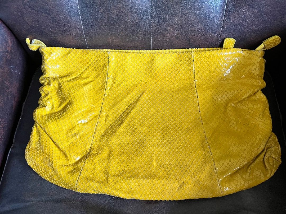 Yellow snakeskin print clutch/envelope bag (Category: Clutches) located in Makati City. Submitted by Ina_Ndang (Listing ID 1468714243, Image 1). Description: Yellow snakeskin print clutch/envelope bag Can be used as ipad bag Rubs on corner due to age and usage Approx. dimension: 15.5" (W), 10.2" (H) Payment thru Gcash Shipping thru J&T or depending on available courier NO RUSH shipping NO RETURN.