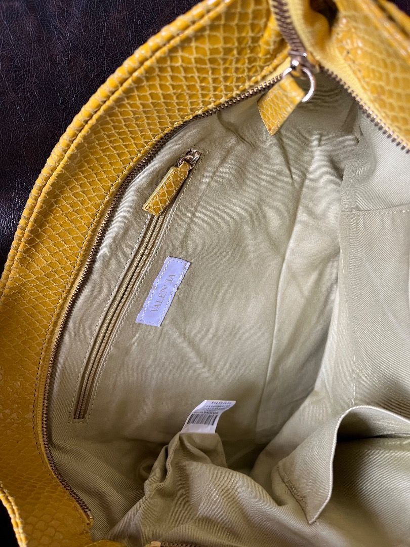 Yellow snakeskin print clutch/envelope bag (Category: Clutches) located in Makati City. Submitted by Ina_Ndang (Listing ID 1468714243, Image 3). Description: Yellow snakeskin print clutch/envelope bag Can be used as ipad bag Rubs on corner due to age and usage Approx. dimension: 15.5" (W), 10.2" (H) Payment thru Gcash Shipping thru J&T or depending on available courier NO RUSH shipping NO RETURN.
