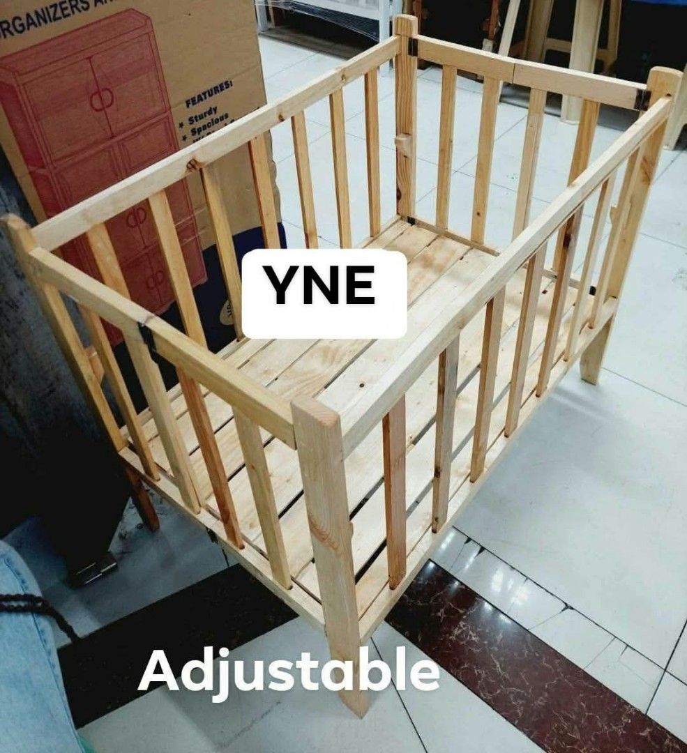YNE Wooden Adjustable Dropside Baby Crib (Category: Cots & Cribs) located in Manila. Submitted by ajimdolor012051 (Listing ID 1468769454, Image 2). Description: - Brand: YNE wooden baby crib - Finish: Natural wood - Design: Sturdy slatted construction for safety and ventilation - Features: Convenient drop side for easy access - Comfort: Adjustable height settings to grow with your baby - Build: Solid frame, durable, and built to last.