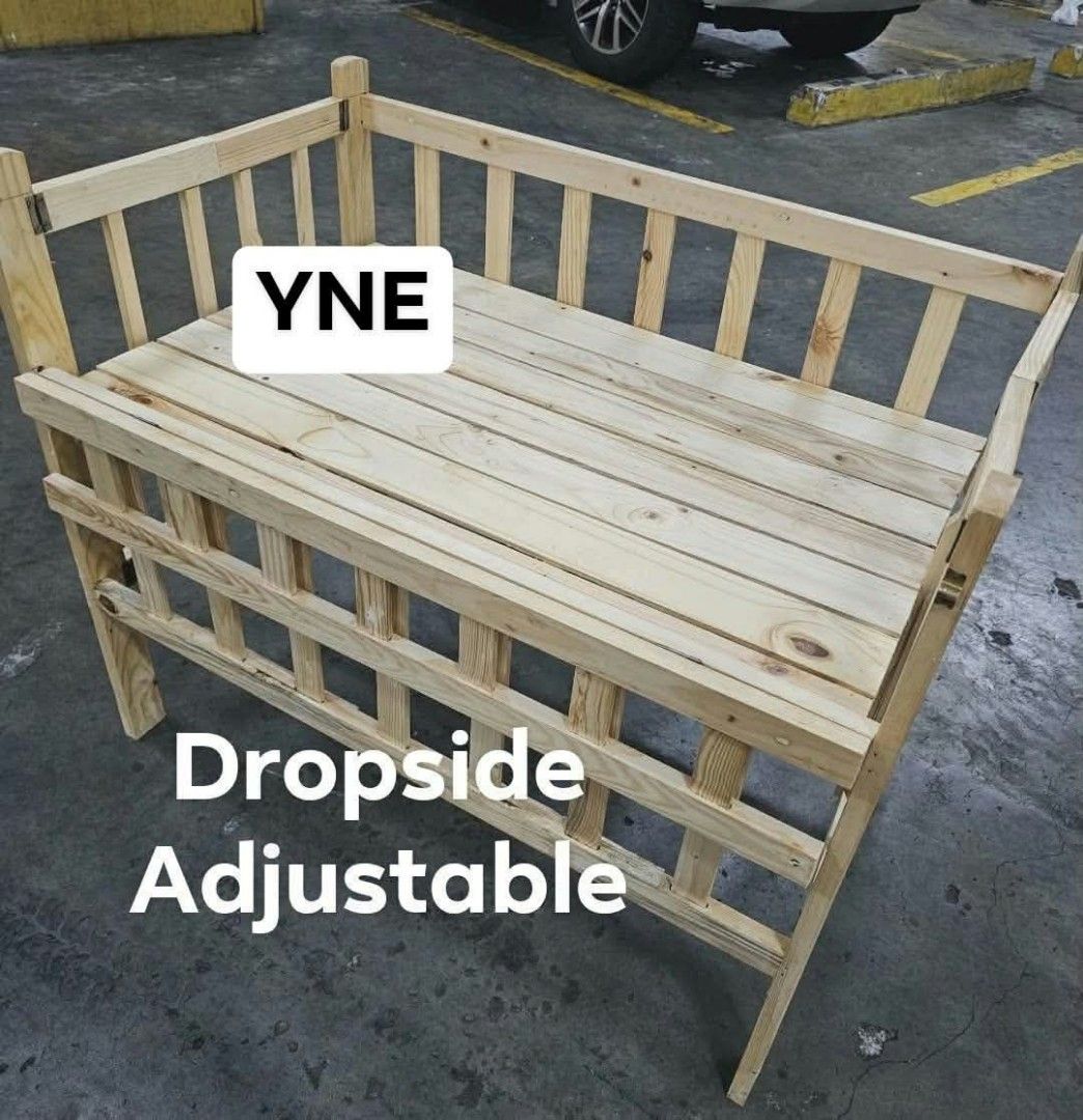 YNE Wooden Adjustable Dropside Baby Crib (Category: Cots & Cribs) located in Manila. Submitted by ajimdolor012051 (Listing ID 1468769454, Image 3). Description: - Brand: YNE wooden baby crib - Finish: Natural wood - Design: Sturdy slatted construction for safety and ventilation - Features: Convenient drop side for easy access - Comfort: Adjustable height settings to grow with your baby - Build: Solid frame, durable, and built to last.
