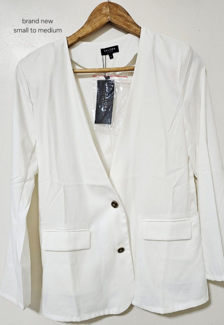Zalora White Blazer Size S (Category: Coats, Jackets and Outerwear) located in Laoag. Submitted by __baptistakim (Listing ID 1468821659, Image 1). Description: Zalora white blazer, brand new with tags attached still in the plastic wrapper. Size S, fits small to medium frames. Clean front button closure with two functional flap pockets. Long sleeves, sharp tailored look for office or casual wear. Grab it before it goes..