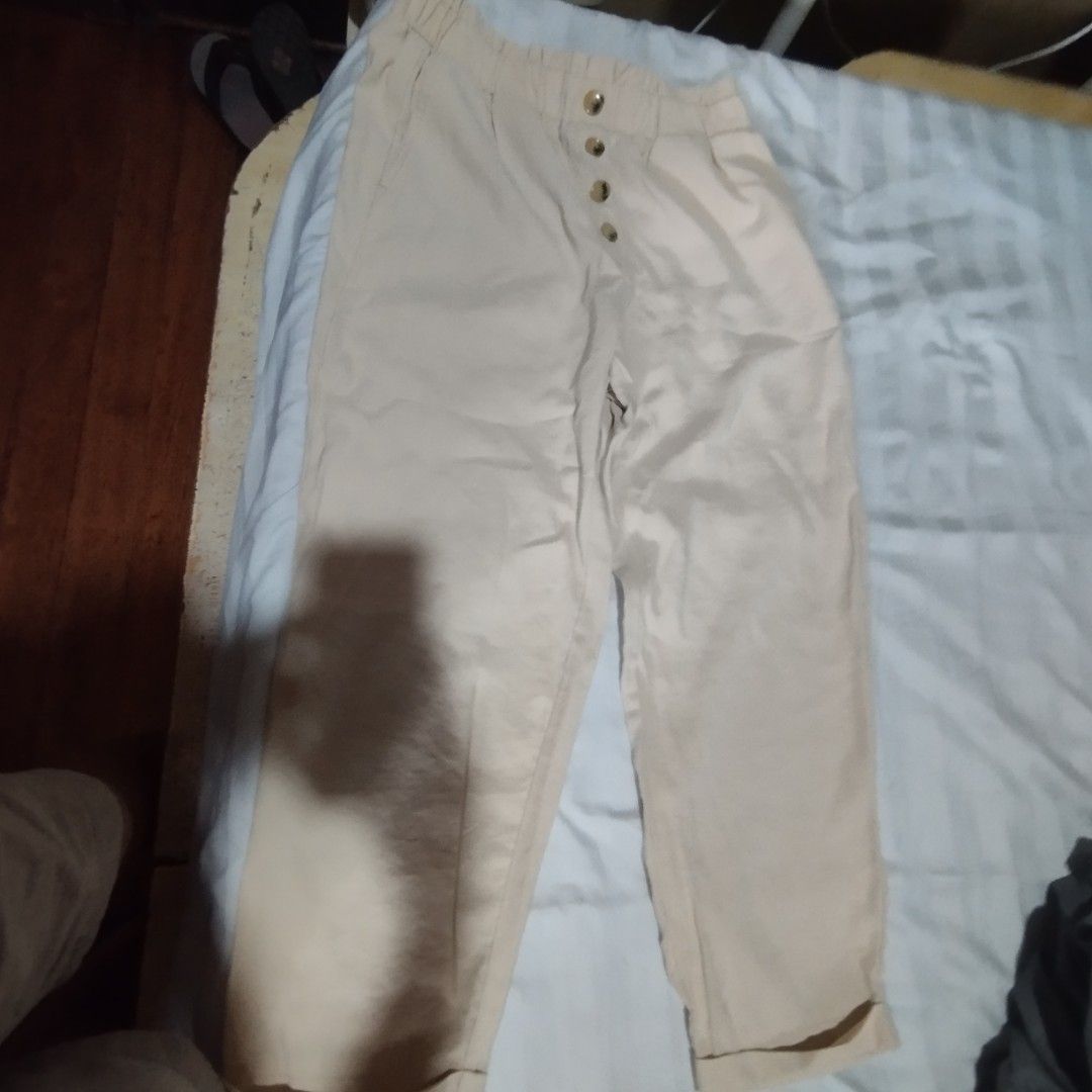 Zara Beige High Waisted Pants (Category: Jeans) located in Manila. Submitted by lene48 (Listing ID 1468726785, Image 2). Description: - Brand/Model: Zara beige pants - Size: L - Waist: Elastic waistband with cute tortoiseshell buttons - Fit: Relaxed fit with cuffed hems - Fabric: Soft and comfortable for all-day wear - Styling: Easy to match with basic tops and blouses.