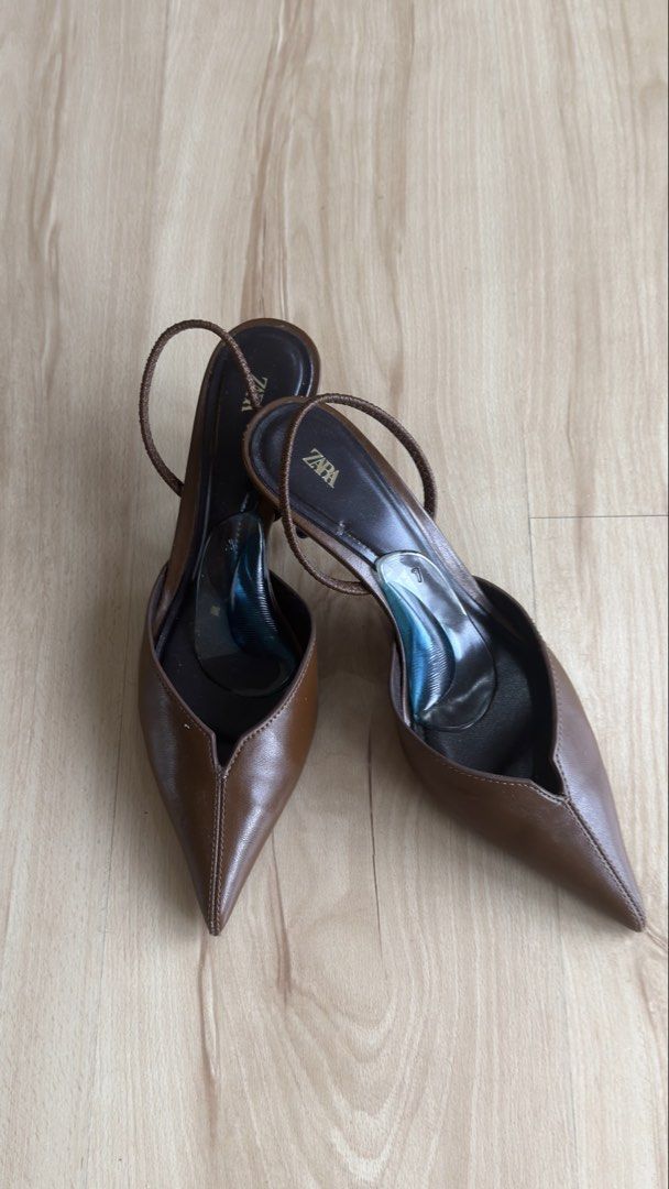 Zara Brown Pointed Slingback Heels Size 37 (Category: Heels) located in San Mateo. Submitted by csilv (Listing ID 1468736553, Image 1). Description: Zara slingback heels in brown leather. Size 37. Pointed toe design with slim heels and delicate straps. Comfortable gel insoles already attached inside. Bottom soles show minor wear from previous outings. Great staple pair for work or dressing up..