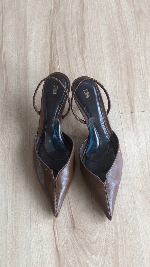 Zara Brown Pointed Slingback Heels Size 37 (Category: Heels) located in San Mateo. Submitted by csilv (Listing ID 1468736553, Image 2). Description: Zara slingback heels in brown leather. Size 37. Pointed toe design with slim heels and delicate straps. Comfortable gel insoles already attached inside. Bottom soles show minor wear from previous outings. Great staple pair for work or dressing up..