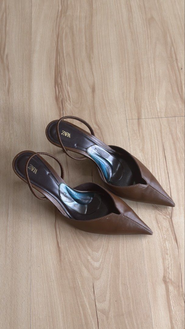 Zara Brown Pointed Slingback Heels Size 37 (Category: Heels) located in San Mateo. Submitted by csilv (Listing ID 1468736553, Image 3). Description: Zara slingback heels in brown leather. Size 37. Pointed toe design with slim heels and delicate straps. Comfortable gel insoles already attached inside. Bottom soles show minor wear from previous outings. Great staple pair for work or dressing up..