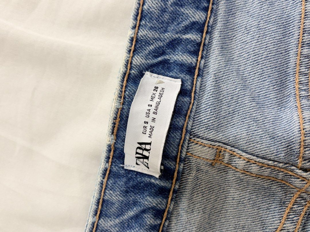 Zara Denim Midi Skirt (Category: Skirts) located in Quezon City. Submitted by fellceas (Listing ID 1468760000, Image 2). Description: - Brand: Zara - Style: Straight midi denim skirt with subtle front split - Wash: Medium blue with contrast stitching - Size: EUR S, USA S, MEX 26 - Details: Classic five-pocket styling, front zip, and button closure - Material: Cotton denim - Condition: Great versatile staple, easy to style with any top.