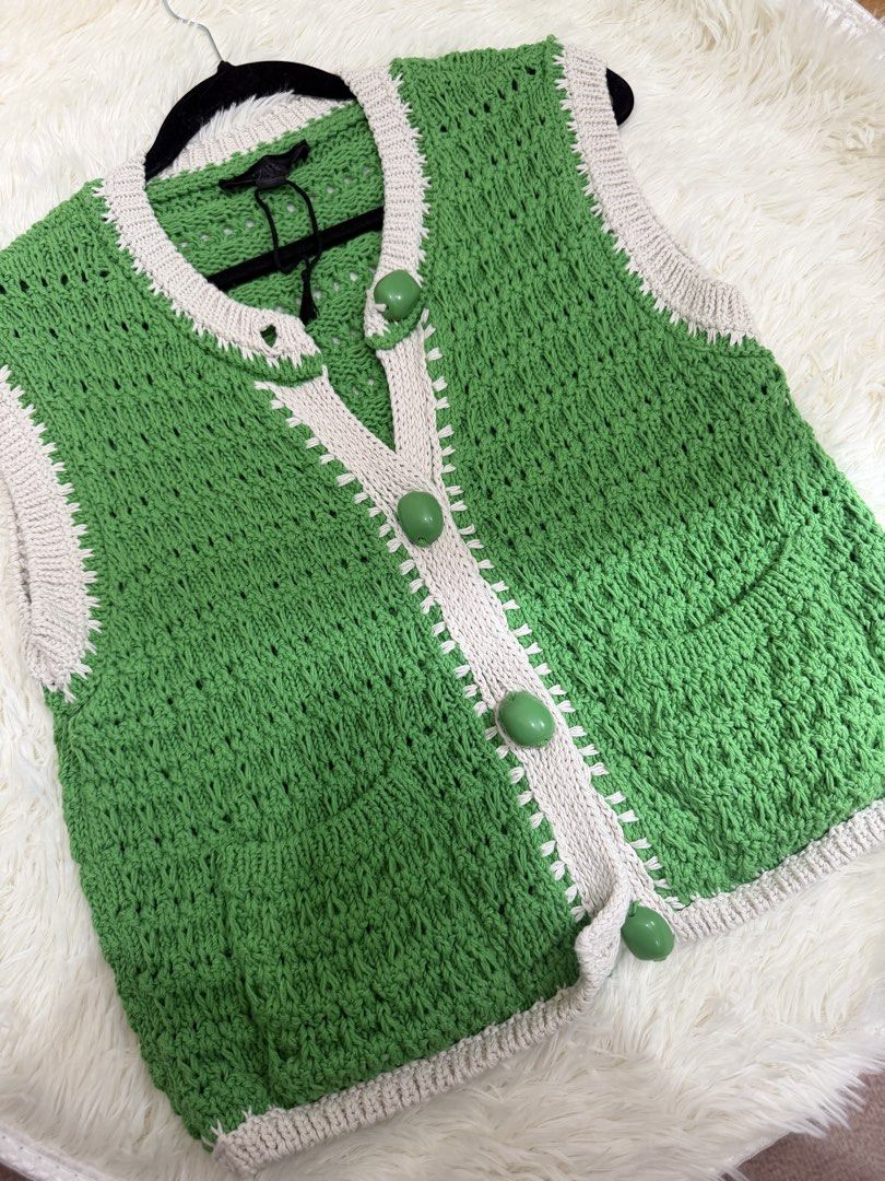Zara Green Knit Button-Up Sweater Vest (Category: Sleeveless) located in Cebu City. Submitted by gdcebu (Listing ID 1468765229, Image 1). Description: - Brand: Zara - Size: S (Made in Turkey) - Color/Style: Green knit sweater vest with contrast white trim - Details: V-neckline, front placket, and large green bead buttons - Versatility: Perfect for layering over tees or wearing on its ownh Worn once.