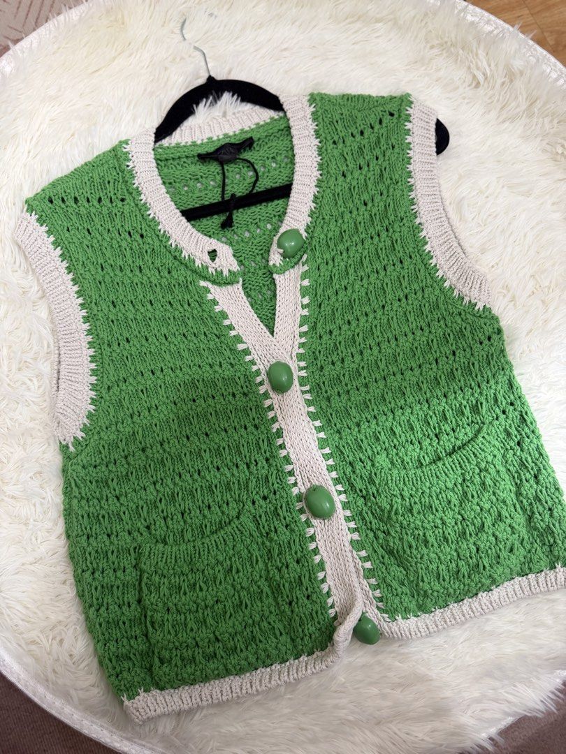 Zara Green Knit Button-Up Sweater Vest (Category: Sleeveless) located in Cebu City. Submitted by gdcebu (Listing ID 1468765229, Image 2). Description: - Brand: Zara - Size: S (Made in Turkey) - Color/Style: Green knit sweater vest with contrast white trim - Details: V-neckline, front placket, and large green bead buttons - Versatility: Perfect for layering over tees or wearing on its ownh Worn once.