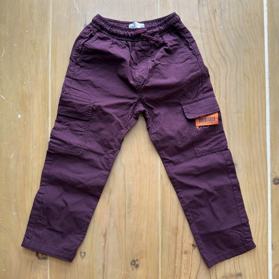 Zara Kids Cargo Pants Size 6 116cm (Category: Babies & Kids Fashion) located in Calamba. Submitted by letsygread9 (Listing ID 1468740579, Image 1). Description: - Brand: Zara - Item: Kids Cargo Pants - Color: Deep Purple - Size: 6 (116 cm) - Material/Origin: Made in Morocco - Waist: Elastic waistband with adjustable drawstring - Pockets: Practical utility pockets on sides and back legs - Condition/Use: Great everyday trousers for kids.