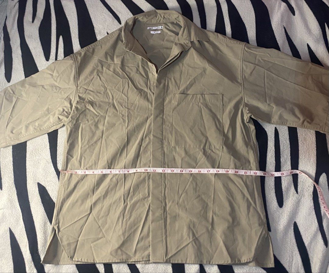 Zara Oversized Button-Down Shirt khaki (Category: Activewear) located in Manila. Submitted by ddxyatchang (Listing ID 1468834004, Image 2). Description: FOR SALE: Zara Oversized Button-Down Shirt - Khaki - Brand: Zara - LEGIT / Authentic - Size S on tag FITS M to XL Oversized (25-26W x 27L) - Color: Khaki Beige - aesthetic / neutral - Fabric: Poly + Viscose + Elastane - stretchy & comfy - Style: Boxy fit, drop shoulder, front pocket - Condition: 