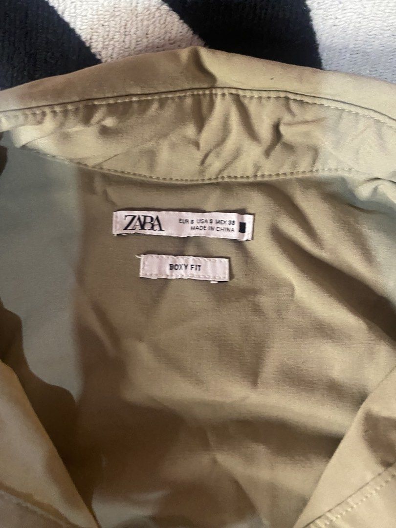 Zara Oversized Button-Down Shirt khaki (Category: Activewear) located in Manila. Submitted by ddxyatchang (Listing ID 1468834004, Image 3). Description: FOR SALE: Zara Oversized Button-Down Shirt - Khaki - Brand: Zara - LEGIT / Authentic - Size S on tag FITS M to XL Oversized (25-26W x 27L) - Color: Khaki Beige - aesthetic / neutral - Fabric: Poly + Viscose + Elastane - stretchy & comfy - Style: Boxy fit, drop shoulder, front pocket - Condition: 