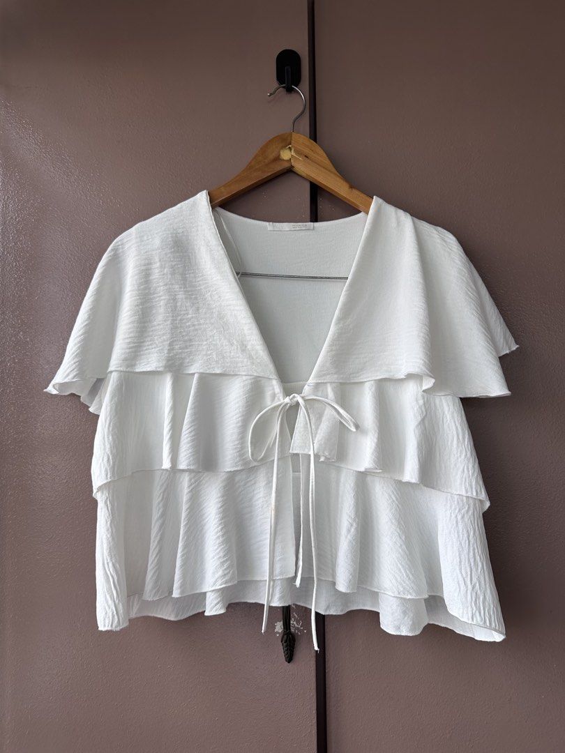 Zara ruffled top (Category: Blouses) located in Abucay. Submitted by closetofaca (Listing ID 1468801050, Image 1). Description: Worn once Has minor stains Bust: up to 40”.