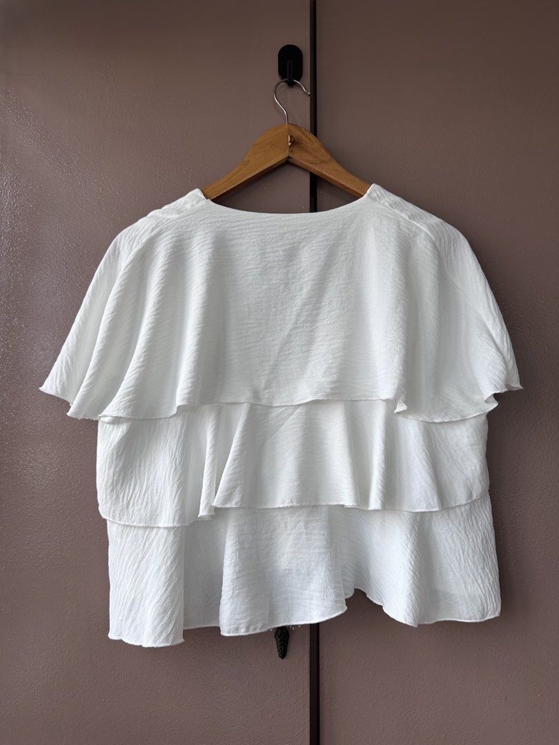 Zara ruffled top (Category: Blouses) located in Abucay. Submitted by closetofaca (Listing ID 1468801050, Image 2). Description: Worn once Has minor stains Bust: up to 40”.