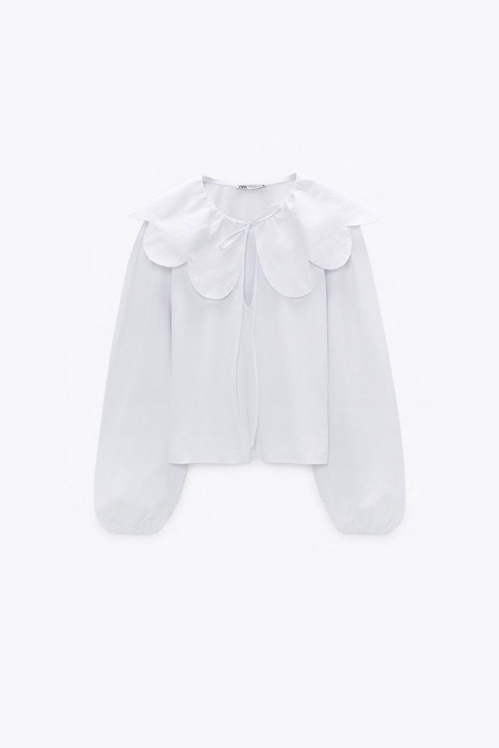 Zara Top (Category: Blouses) located in Manila. Submitted by love.lyxph (Listing ID 1468740644, Image 1). Description: Zara white poplin blouse with an oversized scalloped Peter Pan collar and front tie detail.