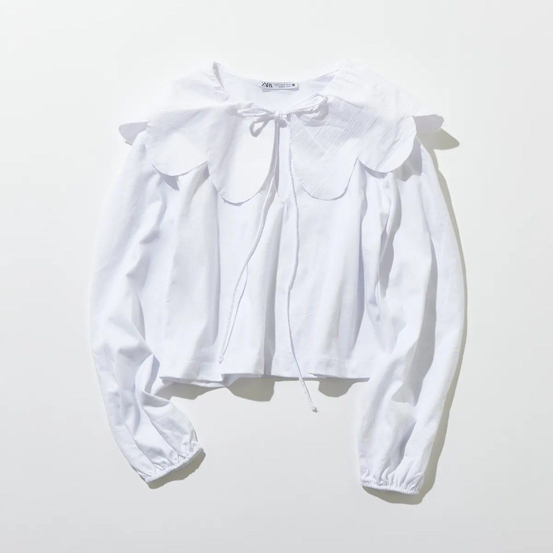Zara Top (Category: Blouses) located in Manila. Submitted by love.lyxph (Listing ID 1468740644, Image 2). Description: Zara white poplin blouse with an oversized scalloped Peter Pan collar and front tie detail.