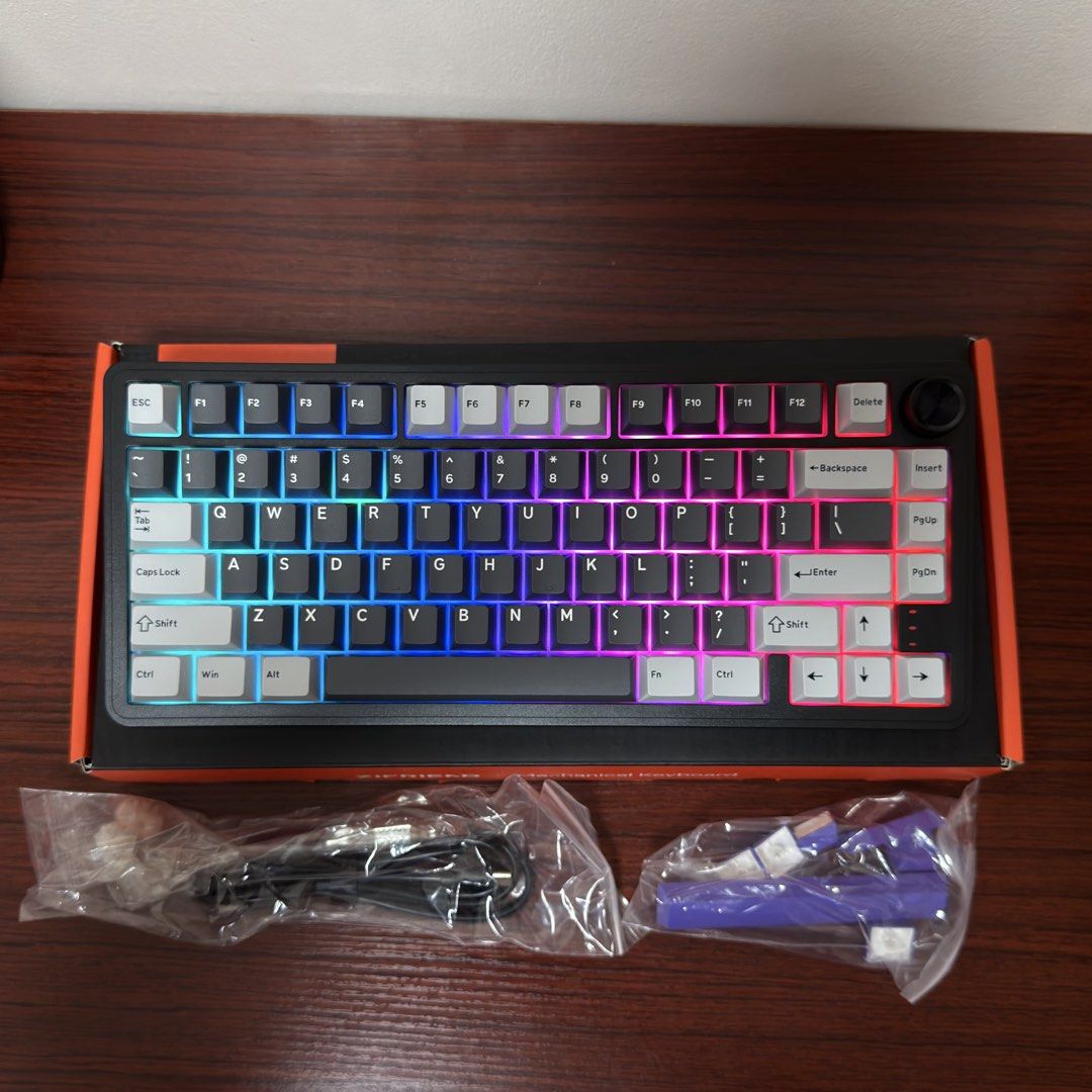 Zifriend RX75 Mechanical Keyboard (Category: Computer Keyboard) located in Quezon City. Submitted by teejcoching (Listing ID 1468778267, Image 3). Description: - Brand: Zifriend RX75 Mechanical Keyboard - Color: Gray and White with colorful RGB lighting - Condition: Brand new, never used (opened only to take photos) - Inclusions: Original box, USB cable, extra purple keycaps, and sealed spare switches - Rado for grabs: Perfect for your setup upgr