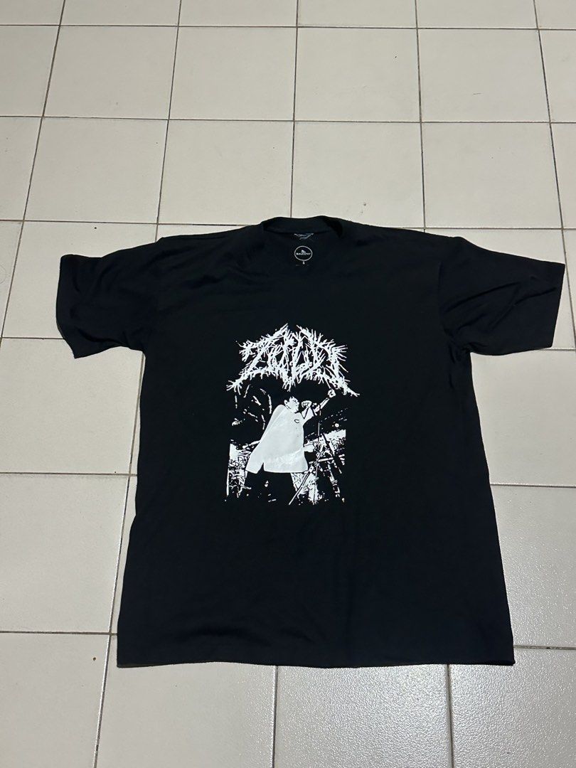 ZILD OG band t-shirt (Category: Shirts) located in Pasig City. Submitted by bluejay23.water (Listing ID 1468838584, Image 1). Description: FOR ZILD FANS OUT THERE. balcony brand. Official - Color: Solid black with no fading - Design: Heavy metal band logo and photo art on the front - Fit: Regular fit with short sleeves and crew neck - Condition: Clean, well-maintained fabric - Style: Simple everyday graphic tee.