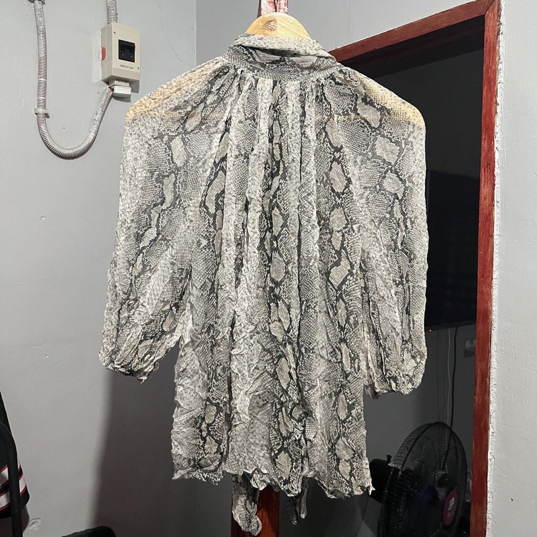 Zimmermann Silk Snake Print Blouse (Category: Luxury Apparel) located in Davao. Submitted by lwndvo (Listing ID 1468901066, Image 3). Description: Zimmermann Silk Snake Print Blouse Like new Authentic Dimensions: Width: 20 Length: 24 Sleeve length: 20 Issue/s: None / need wash fresh from bale Price: 3,800 + shipping .