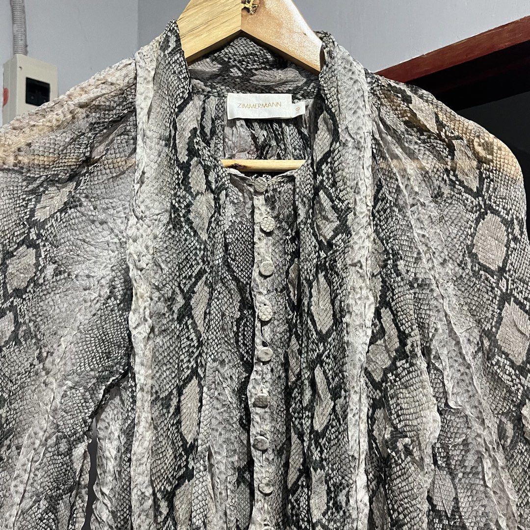 Zimmermann Silk Snake Print Blouse (Category: Luxury Apparel) located in Davao. Submitted by lwndvo (Listing ID 1468901066, Image 1). Description: Zimmermann Silk Snake Print Blouse Like new Authentic Dimensions: Width: 20 Length: 24 Sleeve length: 20 Issue/s: None / need wash fresh from bale Price: 3,800 + shipping .