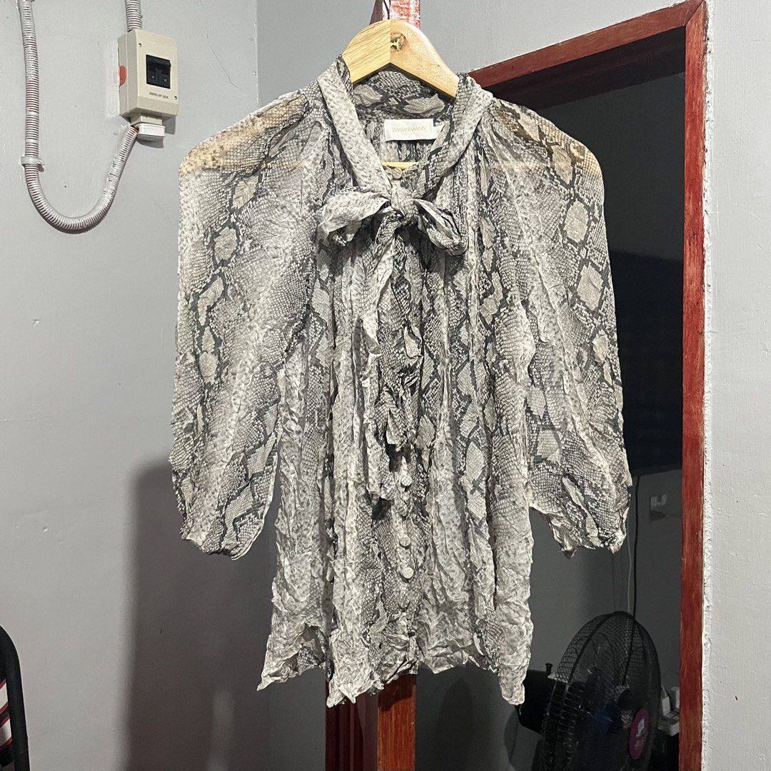 Zimmermann Silk Snake Print Blouse (Category: Luxury Apparel) located in Davao. Submitted by lwndvo (Listing ID 1468901066, Image 2). Description: Zimmermann Silk Snake Print Blouse Like new Authentic Dimensions: Width: 20 Length: 24 Sleeve length: 20 Issue/s: None / need wash fresh from bale Price: 3,800 + shipping .